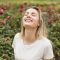 happy-woman-standing-flower-garden