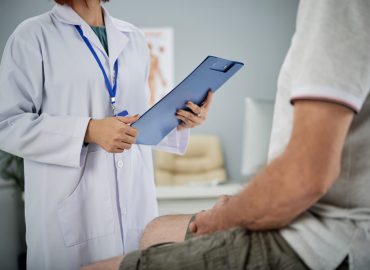 Medical practitioner asking patient questions from the list