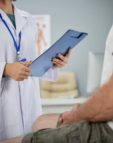 Medical practitioner asking patient questions from the list